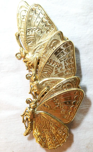 Broche vintage en strass colorés et dorés, de designer