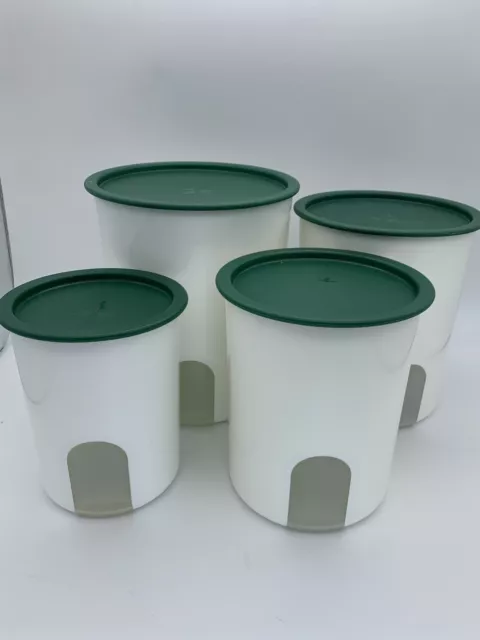 4 Tupperware One Touch Nesting Canisters Set with Green Lids. read description