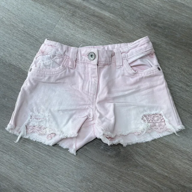 Pantaloncini denim rosa Next indossati per bambina età 7