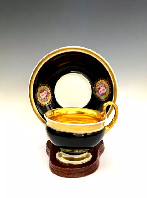 Thomas Bavaria Black and Gilt Cup and Saucer w/ hand painted Floral Panels