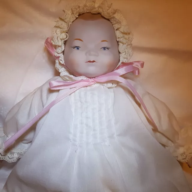Vintage Baby Doll  Porcelain head hands and feet Cloth Body  16" slip dress hat