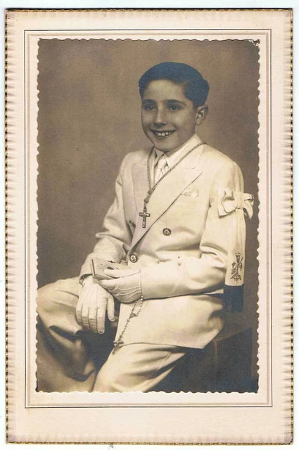 Old photograph of a boy from First Communion on cardboard