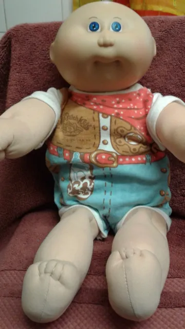 Cabbage Patch Doll Bald Baby wearing an Iconic CPK Romper