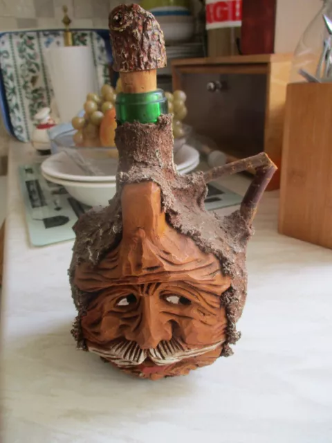 wood carved face decanter