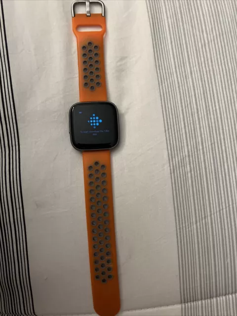 Fitbit Versa 2 watch gray + large orange band. Fitbit Versa 2 watch gray + large orange band.