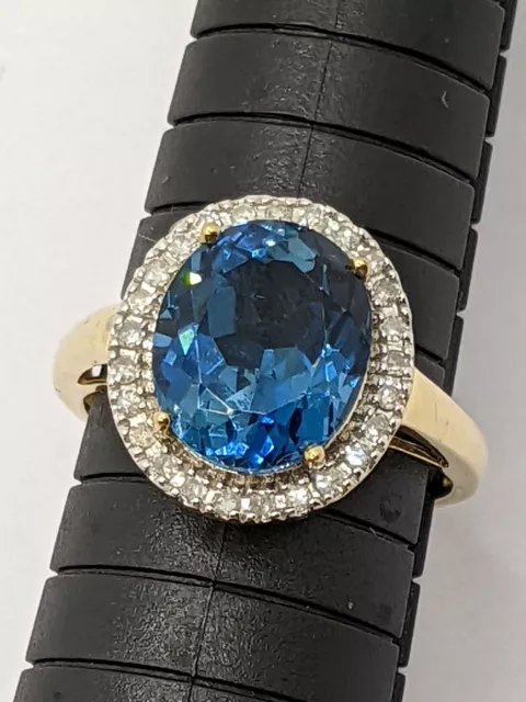 9ct Gold 5ct London Blue Topaz And 0.25 Diamond Halo Ring