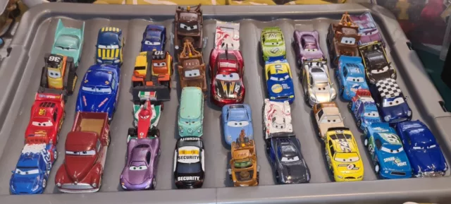 Disney Pixar Cars Joblot Of Over 120 Diecast Vehicles ,and Truck For Storage.