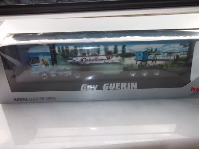 Herpa Scania  TL  Kühlkoffersattelzug " Guy Guerin "  PC Vitrine mit OVP  1:87