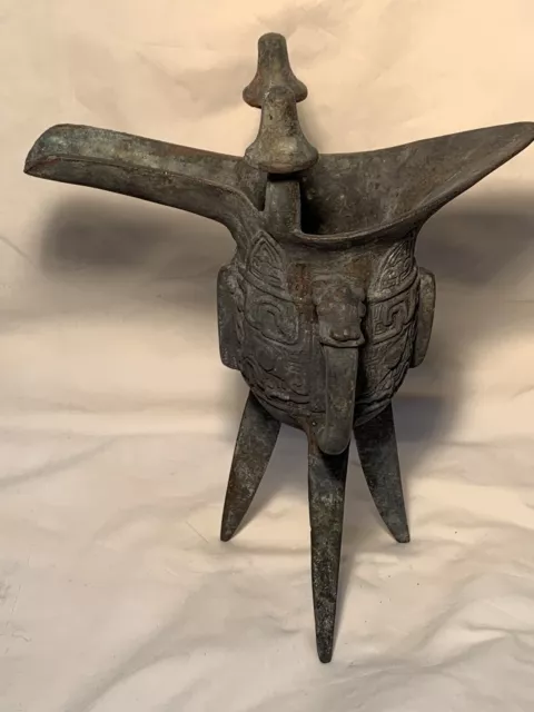 Antique Chinese Solid Bronze Ritualistic Wine Vessel With Patina And Tripod Legs