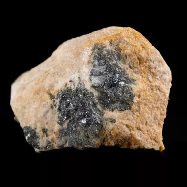 Powellite after Molybdenite on matrix. UV LW Vishnevye Mt., Russia