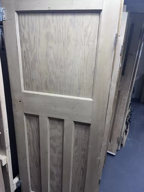 Reclaimed 1930s 1 over 3 panel stripped pine doors.