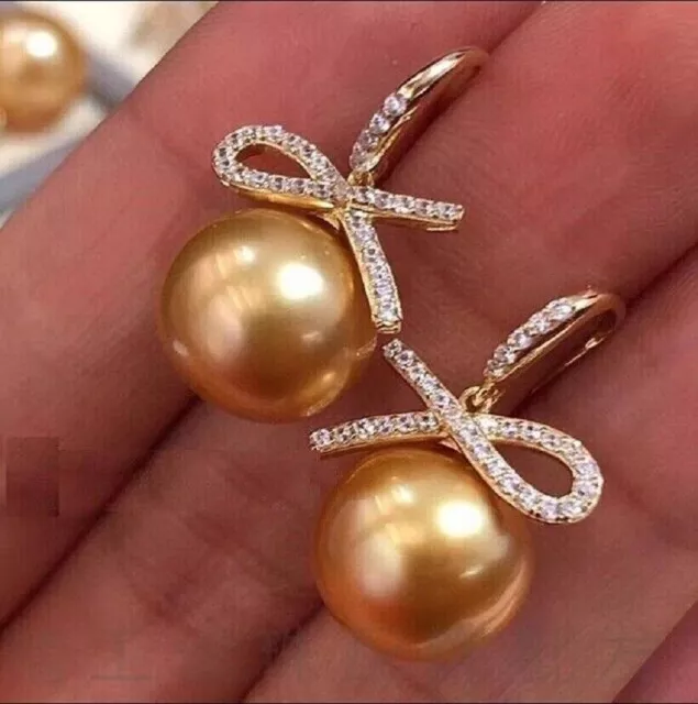 Gorgeous AAAA 10-11mm Natural south sea Round Golden pearl earring 925s