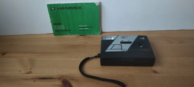 Cámara de disco Hanimex 120 con película e instrucciones - probada y en funcionamiento - utilería/dicc