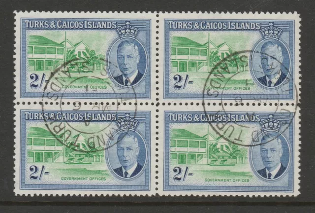 Turks & Caicos Is.1950 2/- Emerald & ultram. in block of four SG 231 Fine used.