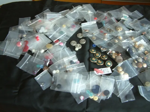 Job Lot of various sized Buttons . Most New as spares from Garments. Some Cover