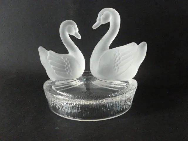 Pair of lead crystal glass swans on clear patterned base,RCR,Italy