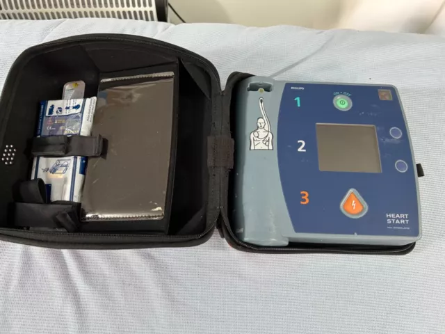 HeartStart Defibrillator with Full Battery, & unused Pads.