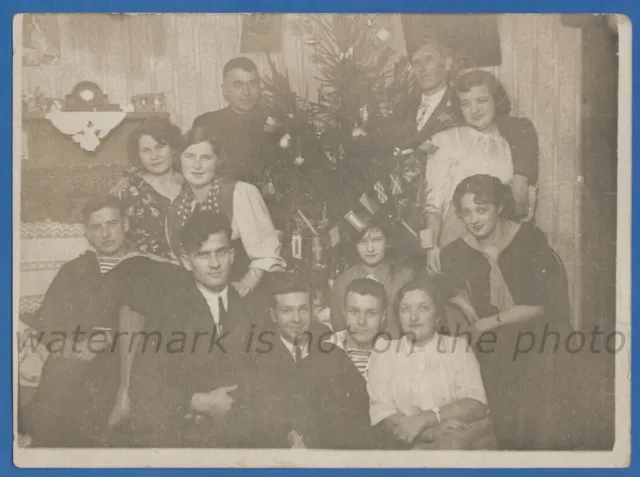 Beautiful guys and girls near the Christmas tree Interior New Year Vintage photo