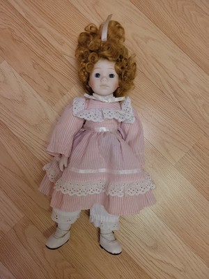 House of Lloyd's porcelain doll red hair blue eyes striped dress Pre owned.16"