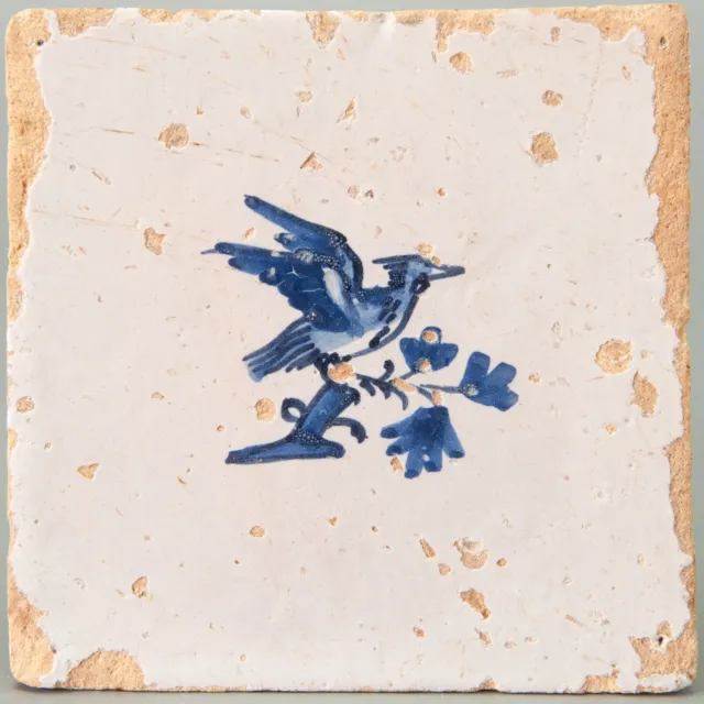 Nice Dutch Delft Blue tile, bird on branch, second half 17th century.