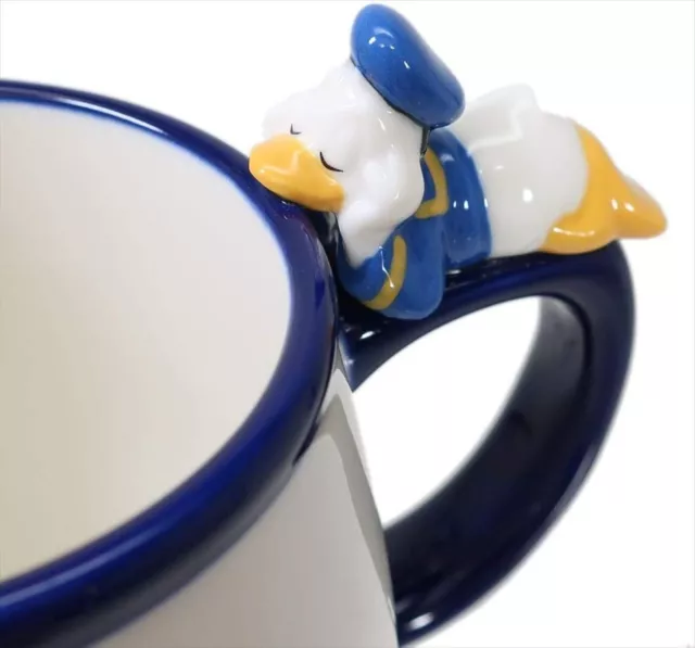 https://www.picclickimg.com/lM8AAOSw4J5kT7DW/Disney-Tableware-Donald-Duck-Sleeping-Figure-Mug-Cup.webp