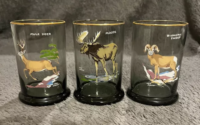 3 - Vintage Ned Smith big game gold rim highball glasses. Smoked glass