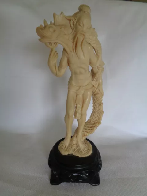 Vintage Japanese Chinese Oriental Resin Figurine of a Man catch a fish like eel