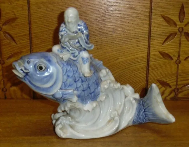 Antique Or Vintage Blue & White Chinese Bisque Man Sitting On Fish Statue AS IS