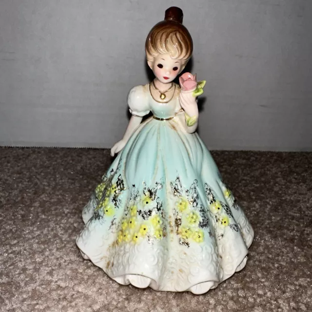 Vintage Josef Figurine Young Lady In Aqua, White And Yellow Gown Holding A Rose