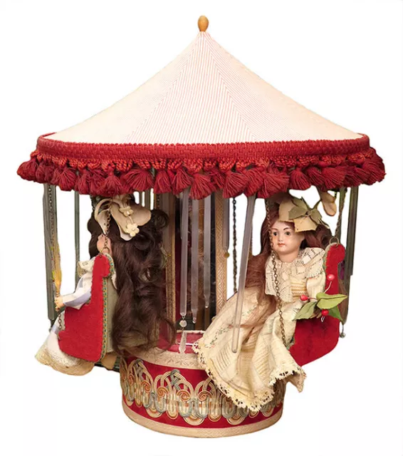 Automate musical de salon représentant un carrousel de nacelles avec poupées