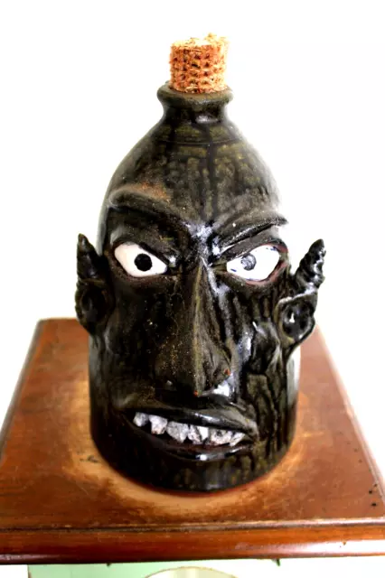 wayne hewell  face jug, pottery, folk art  10''x 7''
