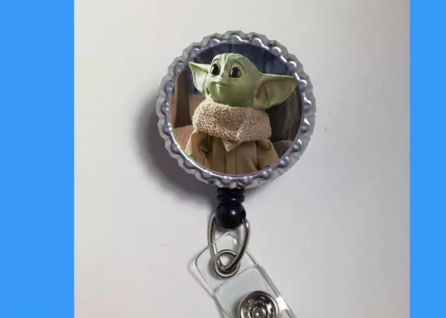https://www.picclickimg.com/lV8AAOSwNmheVd10/Baby-Yoda-star-wars-badge-reel-holder-retractable.webp