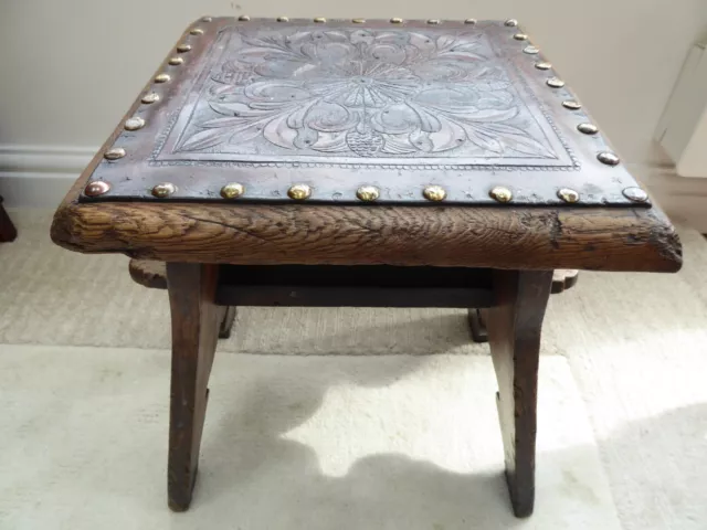 Arts & Crafts pegged oak stool, embossed leather seat, c1900