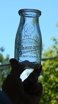 Thomson Dairy Inc. Albert Lea, MN MINN Embossed Half Pint Milk Bottle