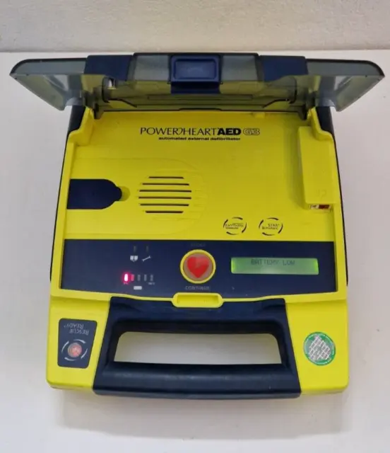 DEFIBRILLATOR POWERHEART AED G3 9300E-1002, with battery. Powers up.