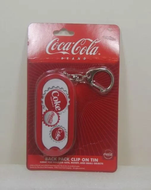 Coca Cola Back Pack clip on tin NIP