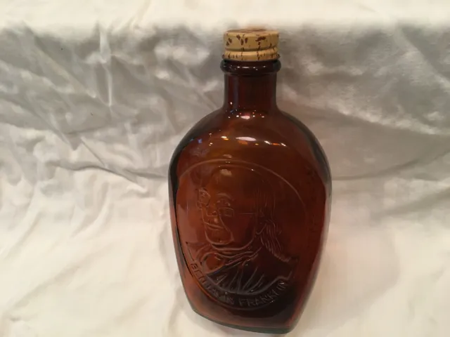 Log Cabin Bicentennial syrup bottle 'Ben Franklin' design. Amber glass, Vintage