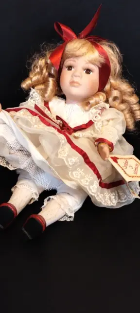 Collector's Choice Musical Animated Sitting Down Bisque Porcelain Doll