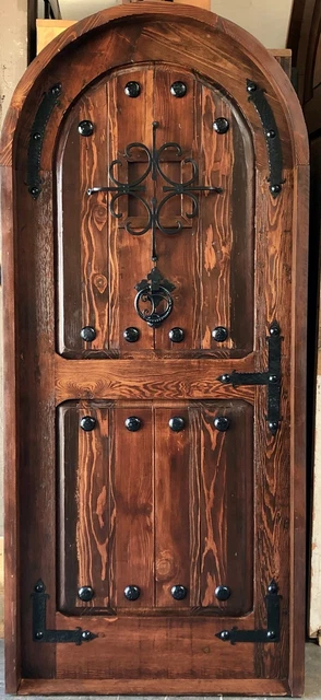 Rustic castle reclaimed lumber arched old growth Doug Fir solid door winery