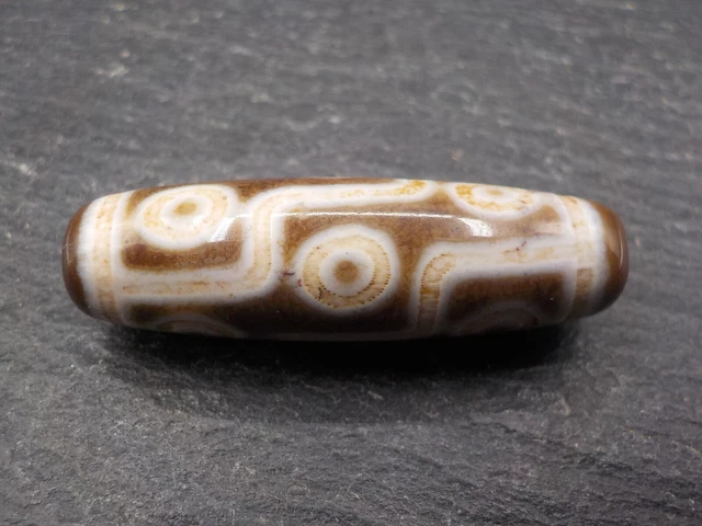 An Agate Dzi bead with a 9 Eye pattern from Tibet / Nepal.
