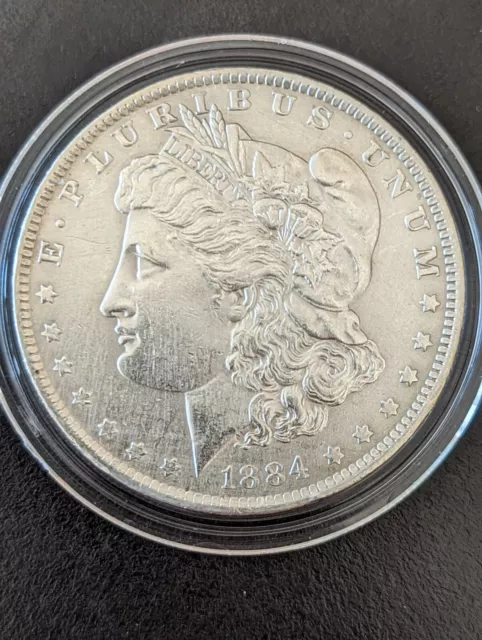 1884 O Morgan USA Silver $1 Dollar in coin capsule