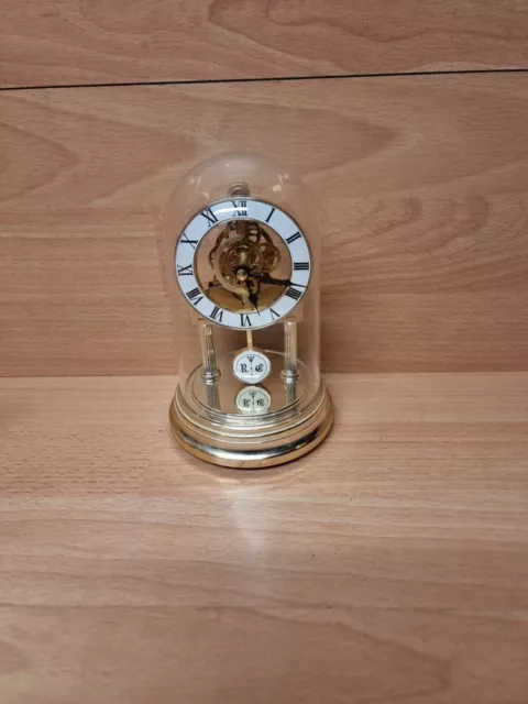 Rhythm quartz  Skeleton anniversary clock gold colour 17cm x 10cm ish