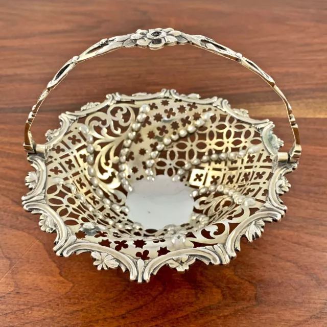 FRANCIS BUTTY, NICHOLAS DUMEE GEORGIAN PIERCED STERLING SILVER GILT BASKET 1760s