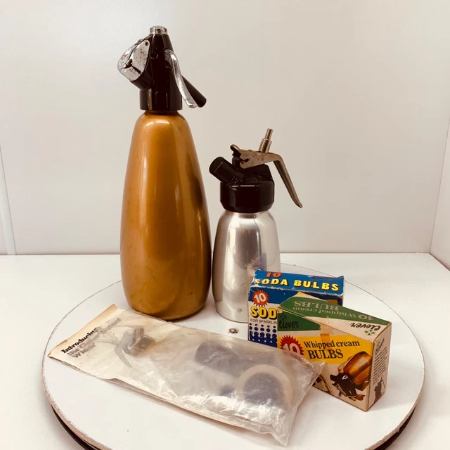 Vintage soda water syphon x 2 large gold and small silver, soda bulbs x2 packs