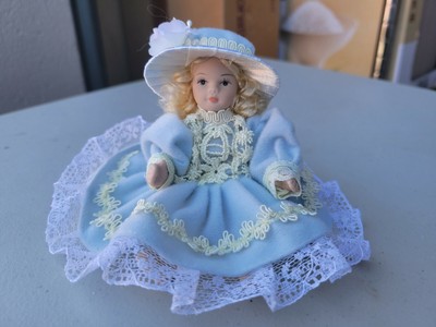 Vintage Porcelain (Jointed) Doll 5" Blond Hair, Black Eyes, Blue Dress & Hat