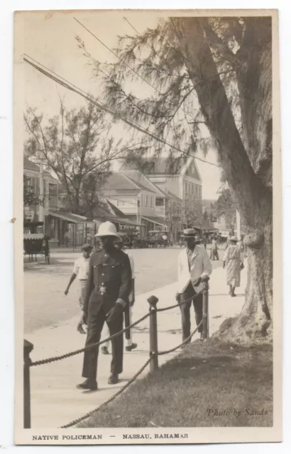 1920s AZO RPPC Postcard of Street Scene in Nassau Bahamas with Policeman
