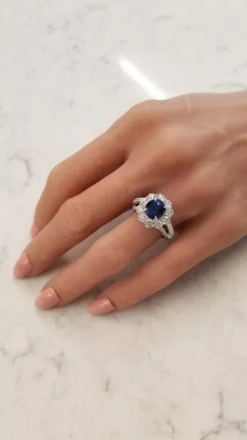 Features A 3.15CT Oval Cut Blue Sapphire With Clear White CZ Cluster Women Ring