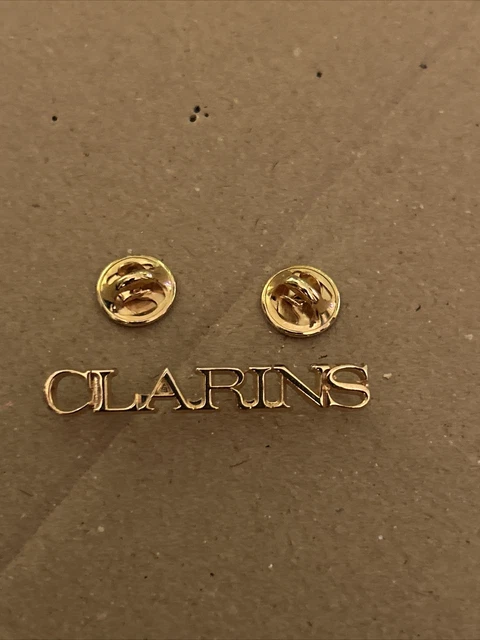 PIN'S ARTHUS-BERTRAND CLARINS Ajouré Bronze Doré 45 x 6 mm EUR 10,00