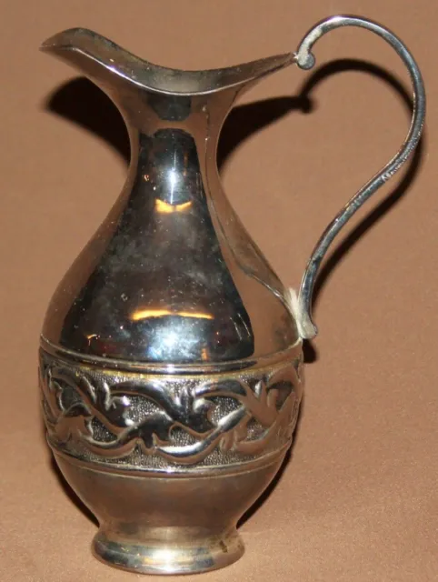 Vintage ornate metal pitcher jug