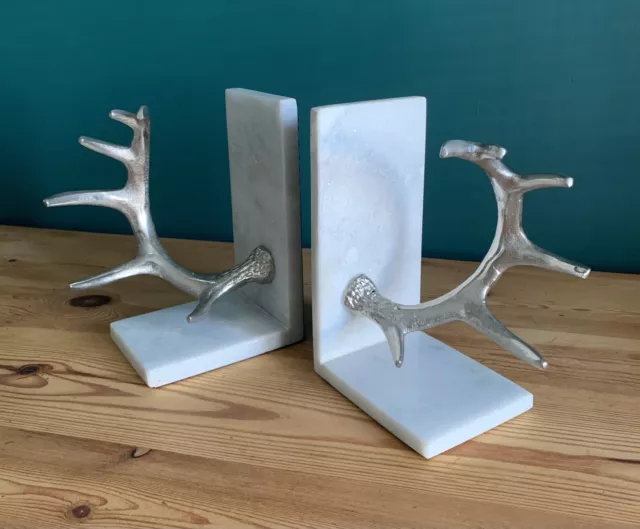 A Pair Of Marble And White Metal Antler Bookends